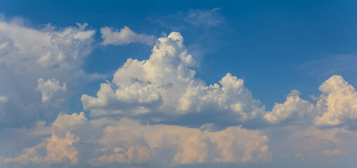 beautiful dense cumulus clouds on blue sky, natural sky background