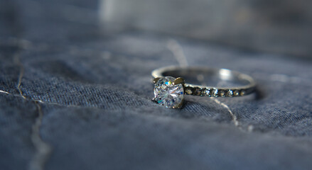 The wedding ring is a white gold ring decorated with diamonds.