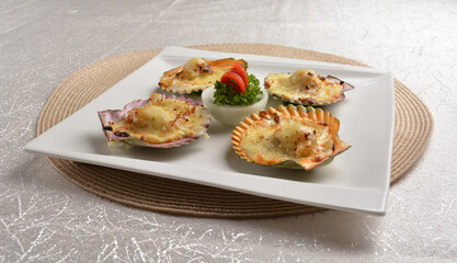 baked cheese cream scallop in shell foie gras canapés in white background asian halal seafood menu