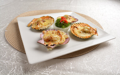 baked cheese cream scallop in shell foie gras canapés in white background asian halal seafood menu