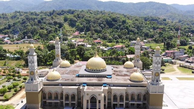 Aerial video of the Baitul Ghafur Grand Mosque in southwest Aceh seen directly from the front with a drone moving forward