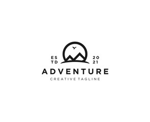 Simple minimalist mountain logo with circular lines and flying birds