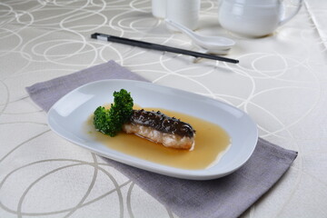 braised cook whole sea cucumber with vegetable in special chef oyster thick sauce in white background asian halal seafood menu