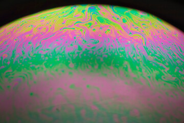 the beauty of the colorful pattern of soap bubbles is like a small planet