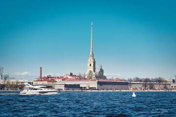 A white sea boat sails along the Neva River in St. Petersburg.