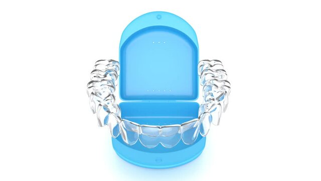 Lower, clear and removable aligner retainer in box case over white background