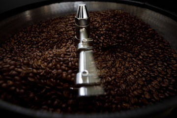  brown coffee beans in roasting spin machine