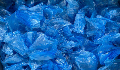 Blue shoe covers. Plastic polyethylene material. Background.