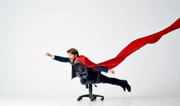 business man in red cloak superman manager office