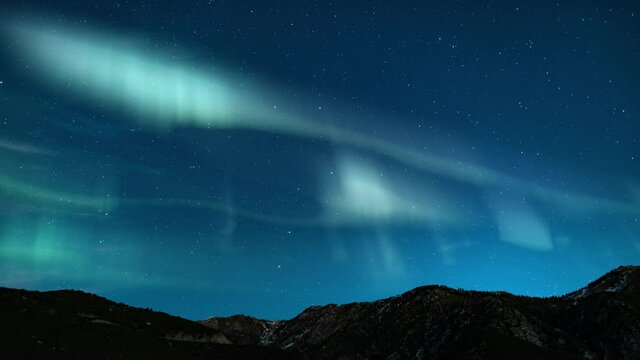 Northern Lights Green Loop Winter Mountain Ridges