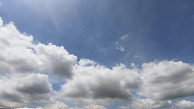 cotton candy fluffy white clouds on gradian blue sky in midday shining sun rays. cloudscape timelapse 4k footage b-roll Nature good weather in summer season, environment nature background concept