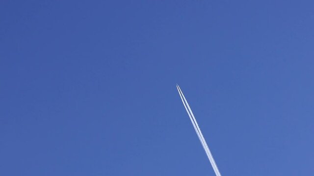airplane contrail against blue sky
