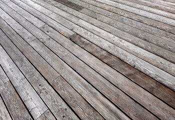 Natural grey surface from wood boards. Decking tiles. Horizontal view
