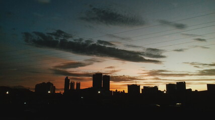 Naklejka na ściany i meble city skyline at sunset