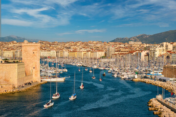Yachts coming to Marseille Old Port on sunset. Marseille, France