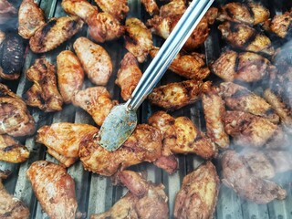 Cooking chicken on the barbecue.