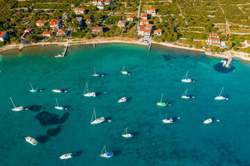 Fototapeta na wymiar Aerial view of the yachts and sailing boats near Ist island, the Adriatic Sea in Croatia