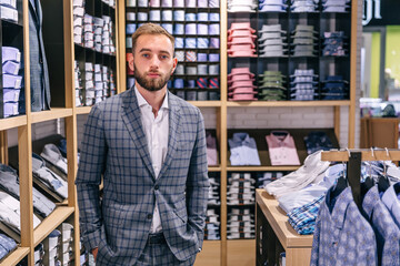 Handsome, successful gentleman posing in a stylish suit.