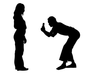 Young woman holds a smartphone in her hand. Isolated silhouettes of people on a white background