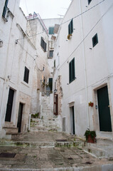 Fototapeta na wymiar Stairs and Houses. Ostuni, Italy