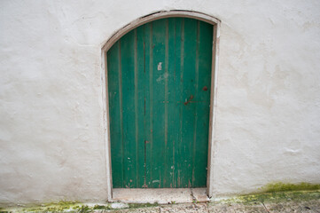 Obraz na płótnie Canvas Emerald Green Ancient Door. Ostuni, Italy