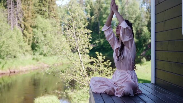 breathing practice in alternative medicine in the lotus position woman restoring health in nature