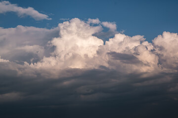 Blue sky background with big white tiny stratus cirrus striped clouds