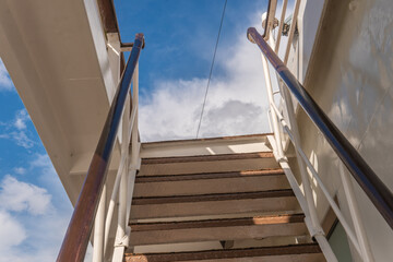 stairs on deck sailing circle travel, beautiful transportation vessel luxury sitting. Bow erminal journey tourists seascape cruise liner lifeboat lower deck drone view of the sky