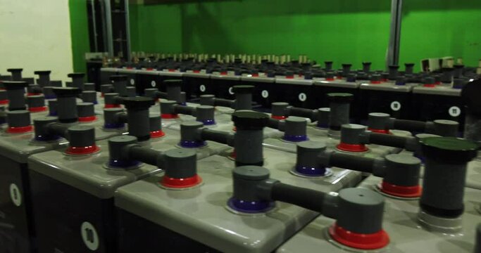 Rows of industrial storage batteries.A room used for backup or uninterruptible power supply. Power station.