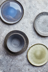 Food background. Empty plates on grey background. Top view, flatlay, copyspace