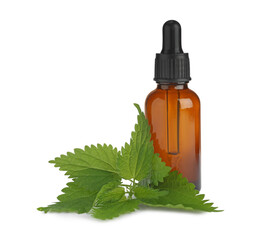 Glass bottle of nettle oil with dropper and leaves isolated on white