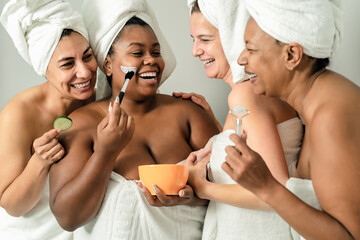 Happy multiracial women with different age and body size having skin care spa day - People selfcare...