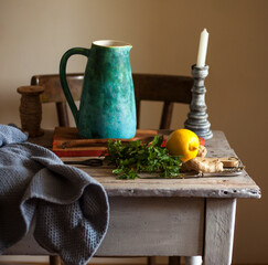 lemonade in a jug, lemon, ginger and  bundle of fresh mint on a vintage table .a healthy lifestyle
