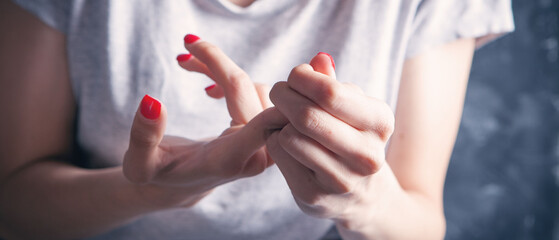 young woman has sore fingers