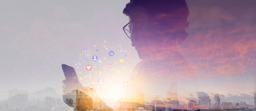 Double exposure of Woman hands using smartphone and show icon social media.Network technology concept.city and mountain background.