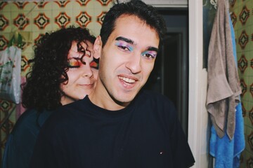 Portrait of queer friends / young couple wearing eyeshadow makeup of lgbtq rainbow pride flag & trans pride flag *4 - obrazy, fototapety, plakaty