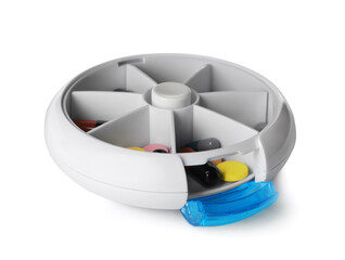 Plastic box with different pills isolated on white