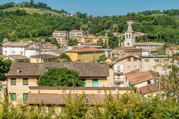 Fototapeta na wymiar A glimpse of the historic center of Spoleto, Italy, on a sunny day