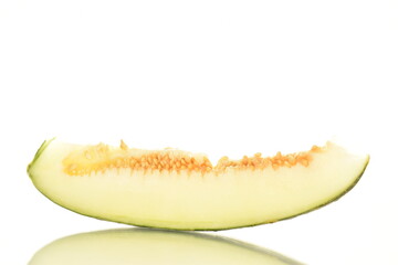 One slice of juicy organic melon, close-up, isolated on white.