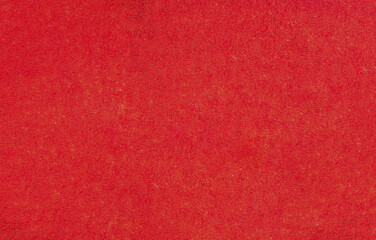 Abstract designer background of shabby red paint on the wall.