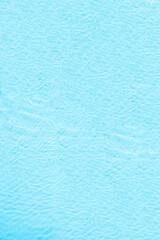 Blue transparent water surface in the swimming pool. Horizontal pool background. Aerial, drone view. Vertical ratio, size