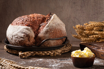 Freshly artisan baked beetroot bread, crunchy bread, country bread. Crispy wheat and rye bread. Simple bread  with butter for breackfast