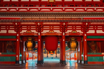 Asakusa Shrine in Japan. Buddhist gate in Japan. Front view of entrance to sensoji temple. Сentral gateway to sensoji area. Red arch in buddhist style. Asakusa Buddhist Temple in Tokyo.