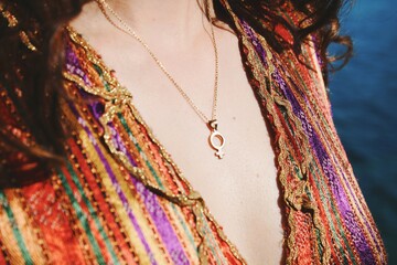 closeup image of chest skin, female gender necklace and turkish ethnic traditional dress *4