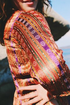 traditional turkish anatolian y&ouml;r&uuml;k patterns and symbols on ethnic costume texture worn by smiling woman