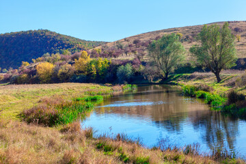 Idyllic valley with river . Awesome nature in September