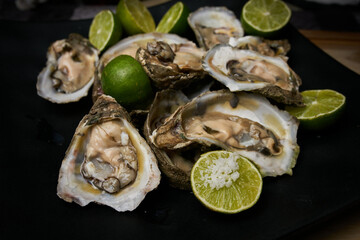Open oysters, prepared with lemon and salt