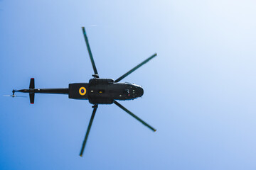 Fototapeta na wymiar military helicopter flying seen from below