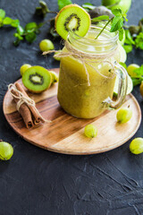 Healthy smoothie of fresh green fruits. Creative atmospheric decoration