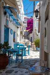 Plakat Traditional paved alley in Tinos town near the port